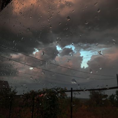 A calm, serene view of the sky through a window.